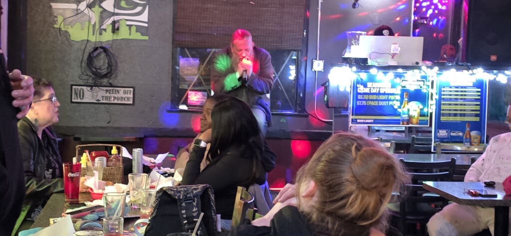 Brady singing at UP Station Bar and Grill